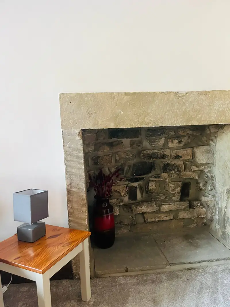 The old stone inglenook inside Spring Cottage